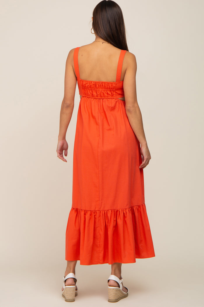 Back view of a woman wearing an orange sleeveless maxi dress with a smocked back and ruffled hem
