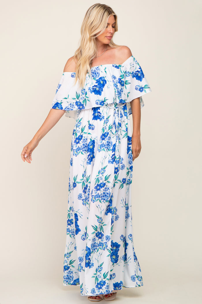 blonde woman wearing a white off-the-shoulder maxi dress with blue floral print
