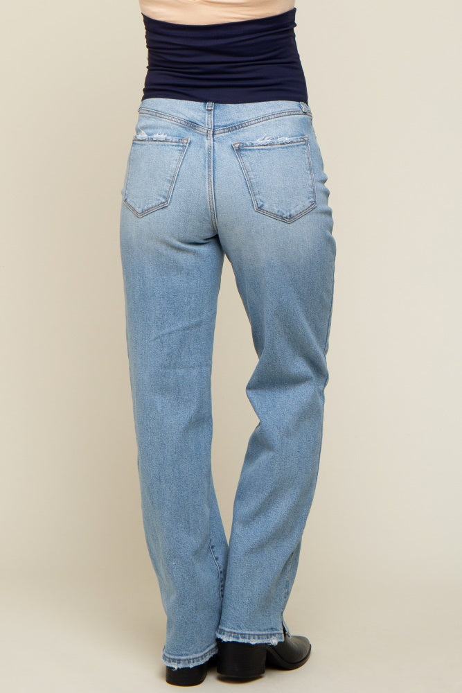 woman wearing light blue maternity jeans, shown from the back