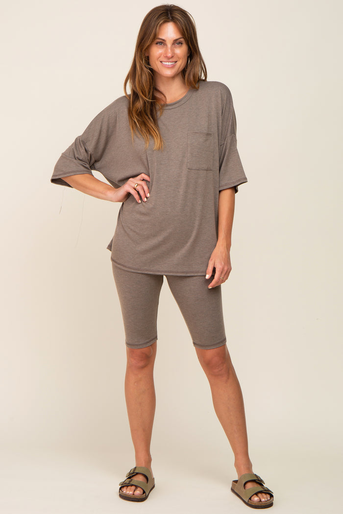 woman wearing brown oversized pocket tee and matching biker shorts lounge set with sandals