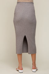 woman wearing a grey ribbed maternity skirt with a back slit, showing a seamless design and fitted silhouette