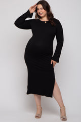 woman wearing a black ribbed maternity plus dress with long sleeves and a side slit, showcasing her baby bump