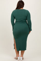 woman wearing a green ribbed midi dress with long sleeves and a side slit, shown from the back