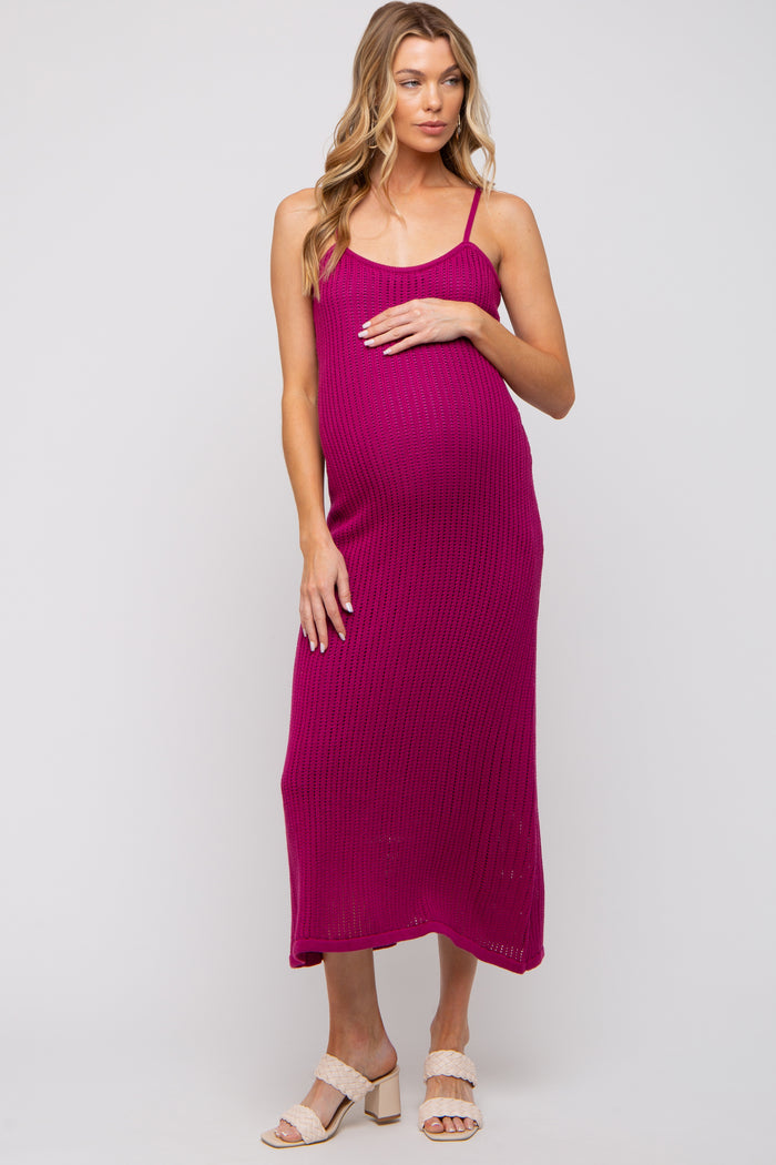 woman wearing a fuchsia ribbed maternity dress with adjustable spaghetti straps and a visible baby bump