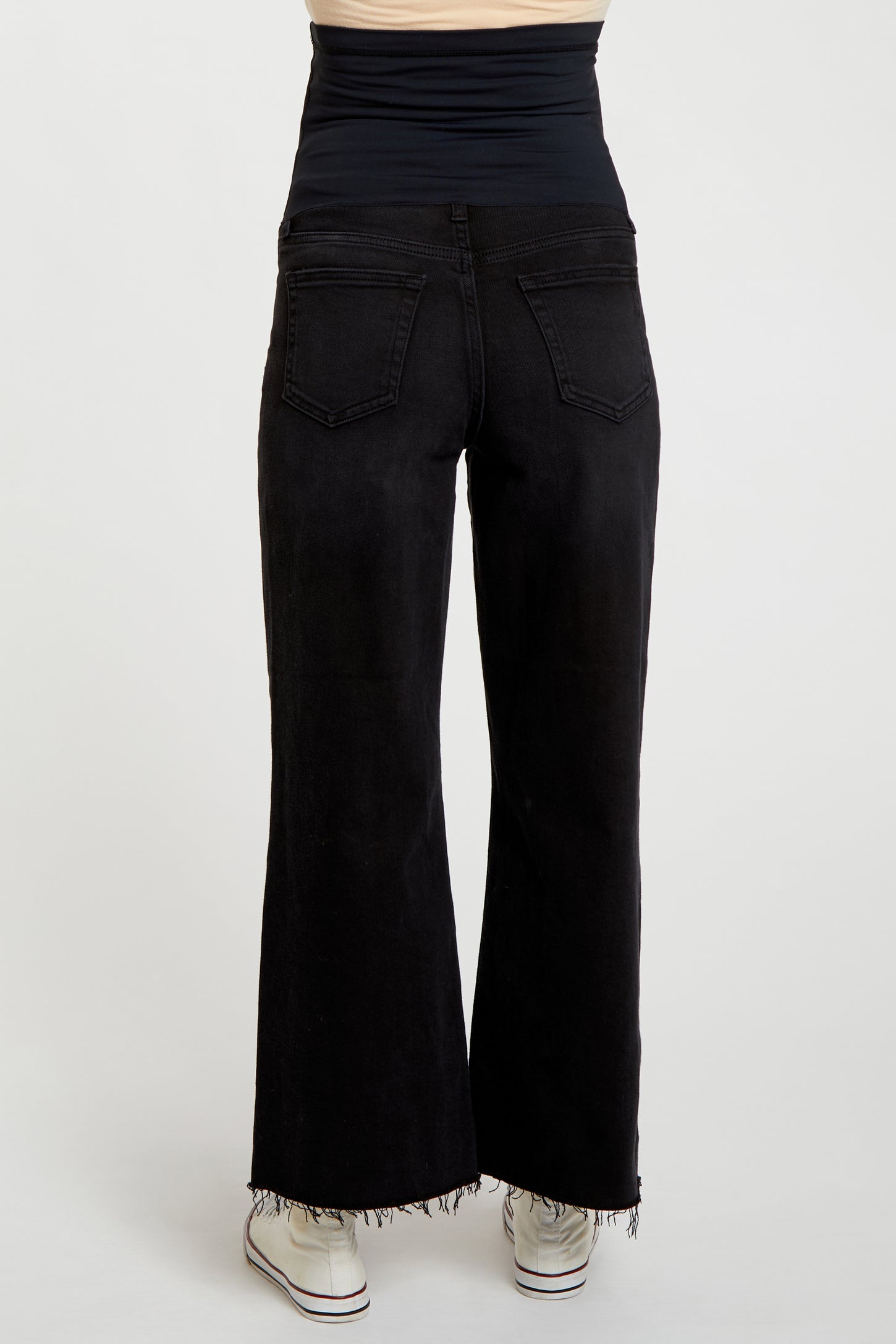 black maternity jeans with a wide leg and stretchy waistband, model showing the back view