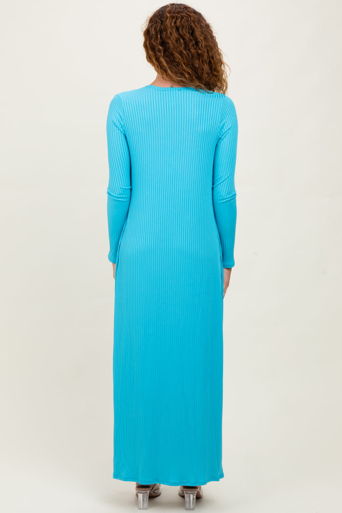 woman wearing a long sleeve ribbed maxi dress in bright turquoise from the back