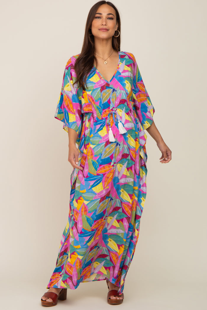 woman wearing a colorful floral maternity dress with a v-neck and drawstring waist